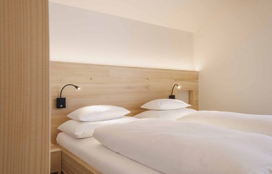 Schlafzimmer in der Wohnung im Hotel Aurora Schlafzimmer in der Wohnung im Hotel Aurora